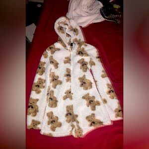 Selling a white one piece with teddy bears on it